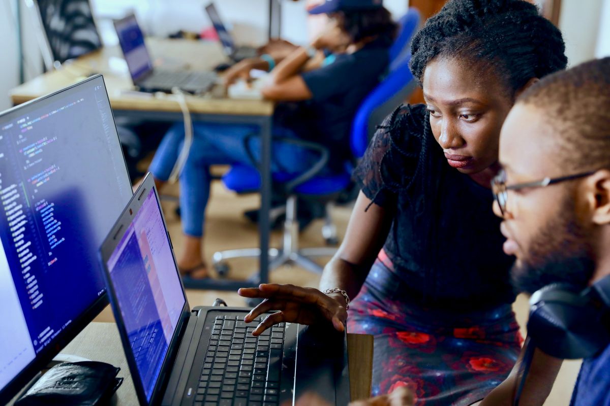 Developers coding / app on screens